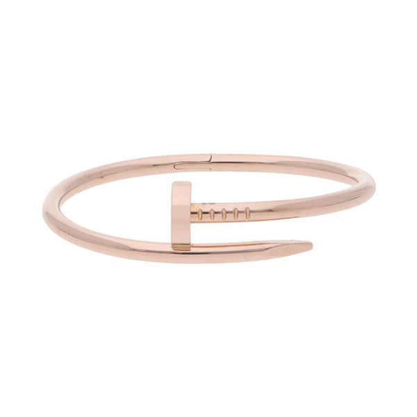 Pulsera de arillo ovalada articulada firma Cartier motivo clavo en oro rosa 18 kilates.