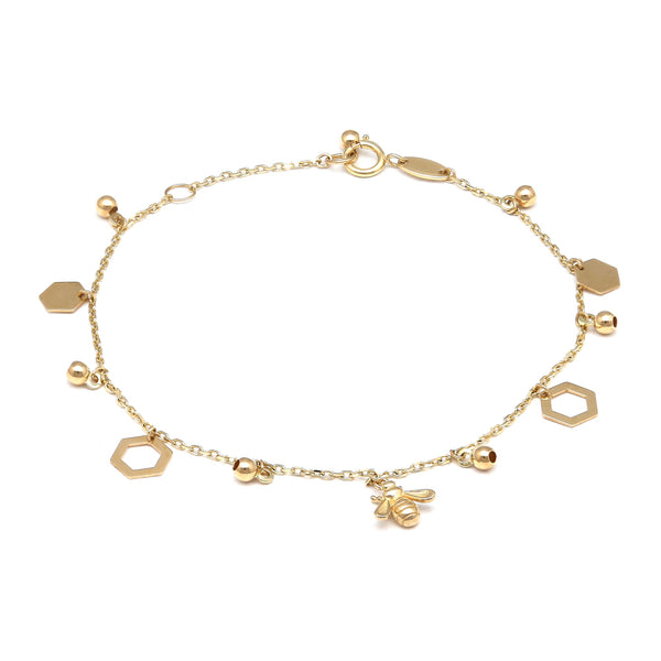 Pulsera eslabón cruzado con colgantes motivo panal y abeja en oro amarillo 14 kilates.