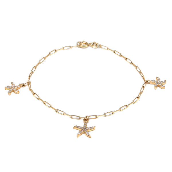 Pulsera eslabón cruzado con colgantes motivo estrellas de mar con circonias en oro amarillo 14 kilates.