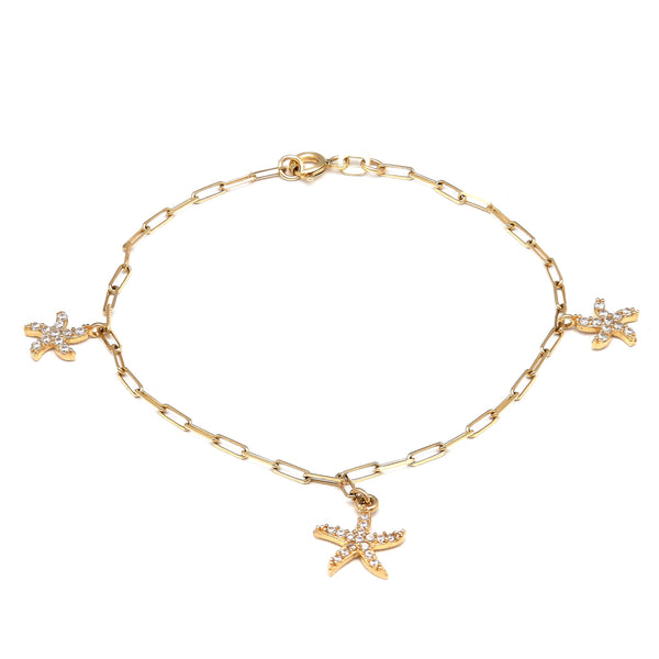 Pulsera eslabón cruzado con colgantes motivo estrellas de mar con circonias en oro amarillo 14 kilates.