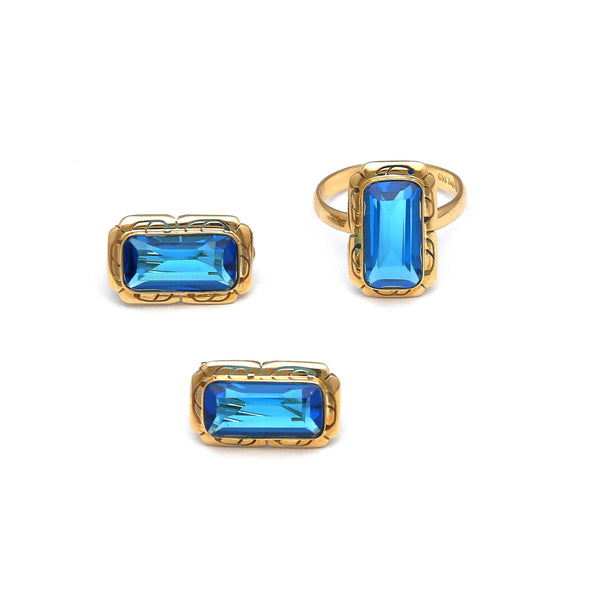 Juego de anillo y aretes diseño especial con topacios London blue en oro amarillo 14 kilates.