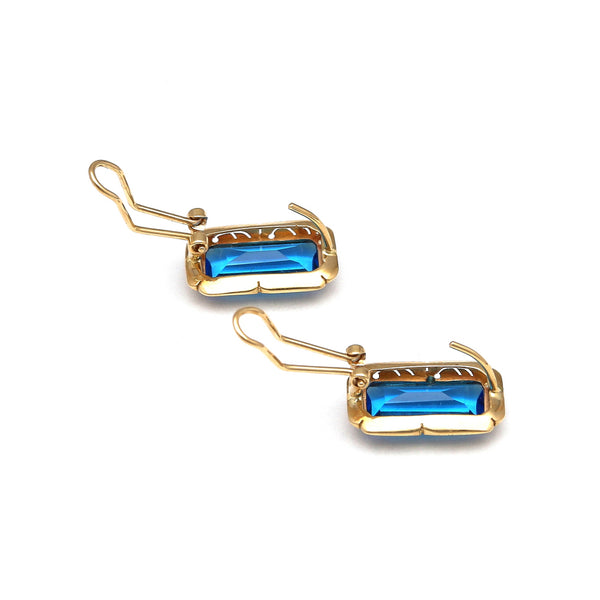 Juego de anillo y aretes diseño especial con topacios London blue en oro amarillo 14 kilates.