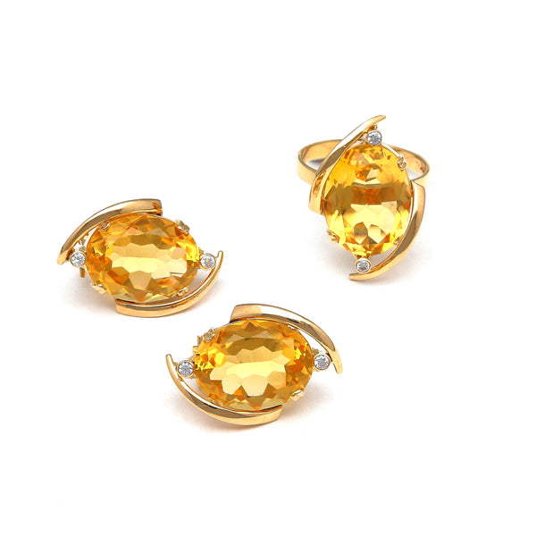 Juego de anillo y aretes diseño especial con citrinos y circonias en oro amarillo 14 kilates.