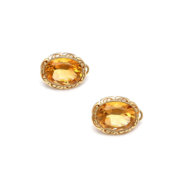 Aretes diseño especial con citrinos en oro amarillo 14 kilates.