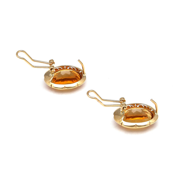Aretes diseño especial con citrinos en oro amarillo 14 kilates.