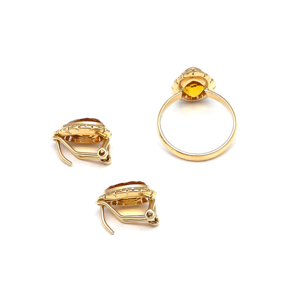 Juego de anillo y aretes calados con citrinos en oro amarillo 14 kilates.