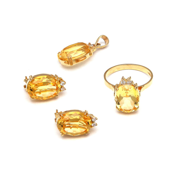 Juego de anillo, dije y aretes diseño especial con diamantes y citrinos en oro amarillo 14 kilates.