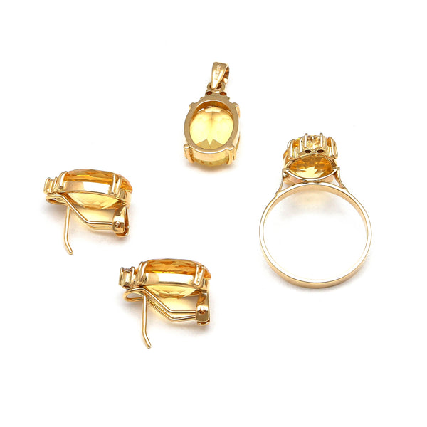 Juego de anillo, dije y aretes diseño especial con diamantes y citrinos en oro amarillo 14 kilates.