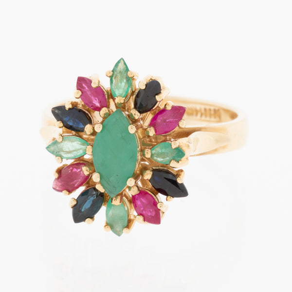 Juego de anillo y aretes estilizados con esmeraldas, rubíes y zafiros en oro amarillo 14 kilates.