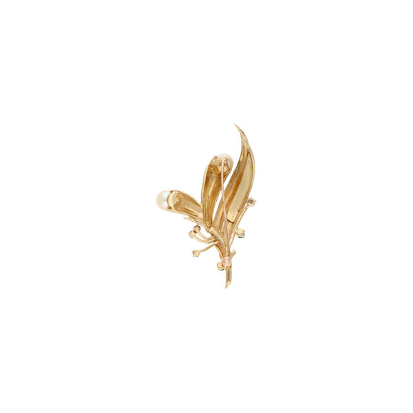 Prendedor diseño especial con perlas y sintéticos en oro amarillo 14 kilates.