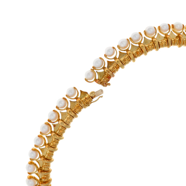 Gargantilla eslabón combinado con diamantes, rubíes y perlas en oro amarillo 18 kilates.