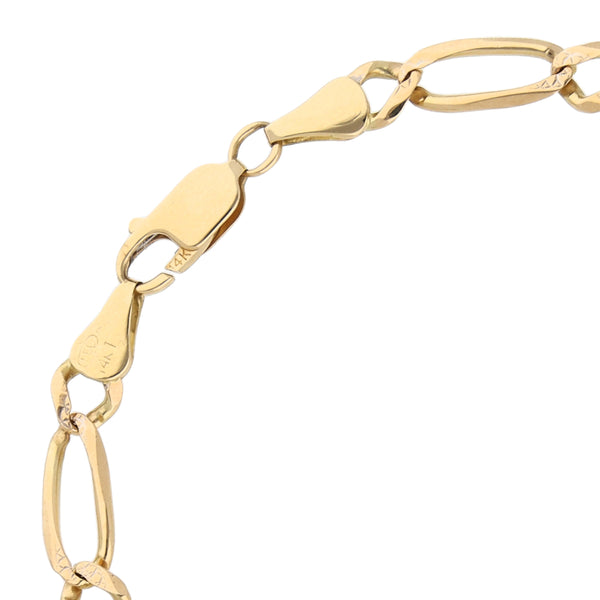 Pulsera de tres eslabones por uno platinados en oro amarillo 14 kilates.