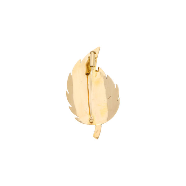Prendedor diseño especial motivo hoja en oro amarillo 18 kilates.