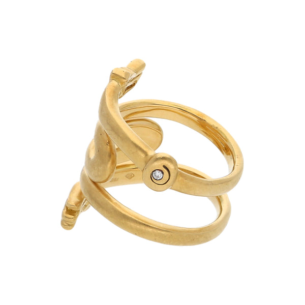 Anillo estilizado motivo felinos con diamante en oro amarillo 18 kilates.