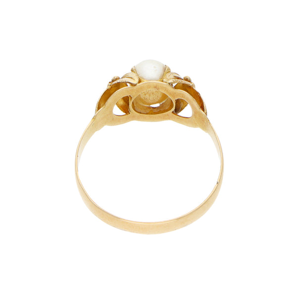 Anillo calado con sintético en oro amarillo 18 kilates.