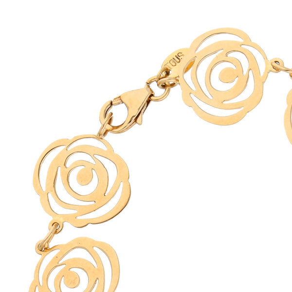 Pulsera eslabón combinado firma Tous motivo floral en oro amarillo 18 kilates.