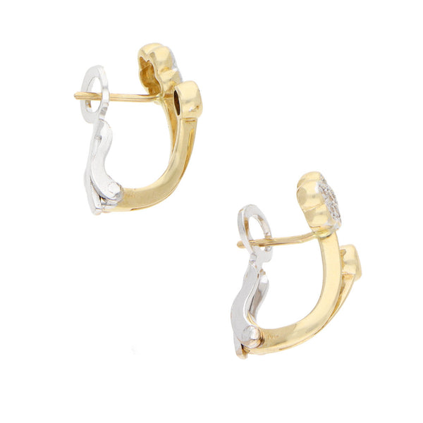 Aretes estilizados motivo floral con circonias en oro dos tonos 14 kilates.