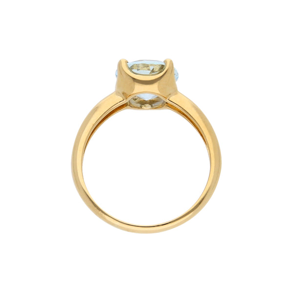 Anillo estilizado con sintético en oro amarillo 18 kilates.