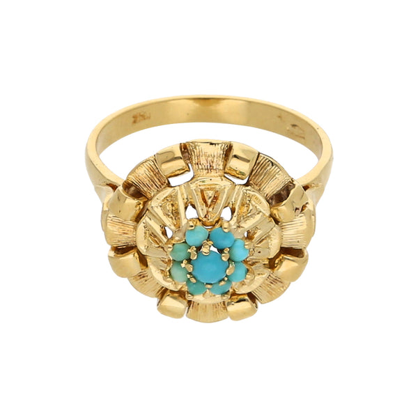 Anillo estilizado con turquesas en oro amarillo 18 kilates.