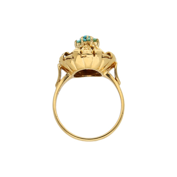 Anillo estilizado con turquesas en oro amarillo 18 kilates.