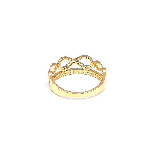 Anillo calado motivo infinitos con circonias en oro amarillo 14 kilates.