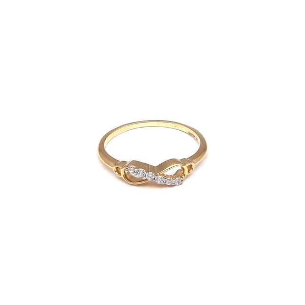 Anillo calado motivo infinito con circonias en oro amarillo 14 kilates.