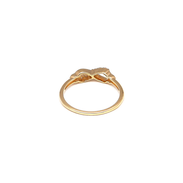 Anillo calado motivo infinito con circonias en oro amarillo 14 kilates.