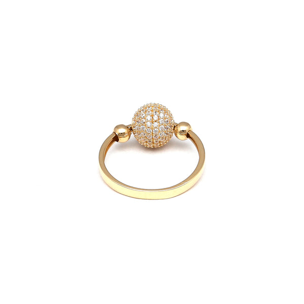 Anillo liso con aplicaciones motivo esfera y sintéticos en oro amarillo 14 kilates.