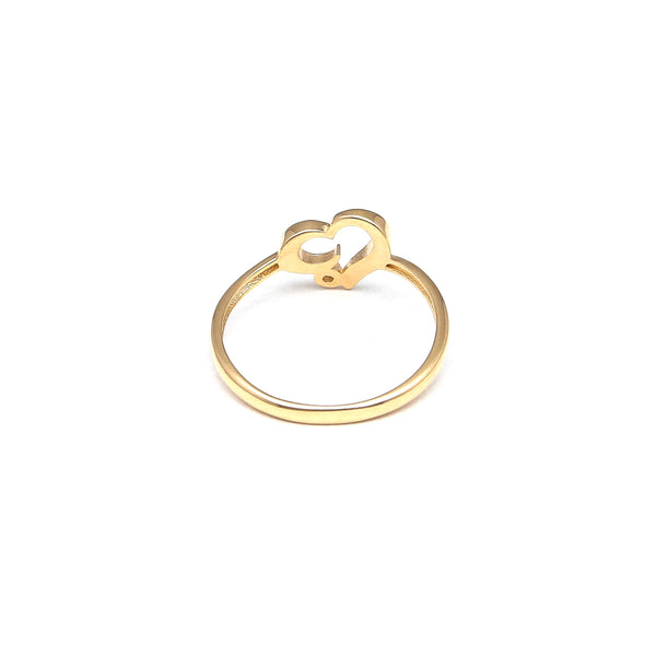 Anillo calado motivo corazón con circonia en oro amarillo 14 kilates.