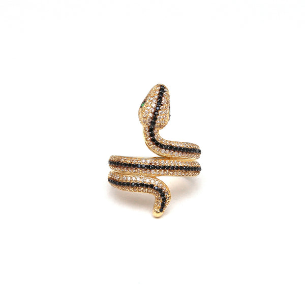 Anillo estilizado motivo serpiente con sintéticos en oro amarillo 14 kilates.