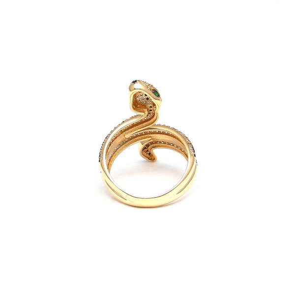 Anillo estilizado motivo serpiente con sintéticos en oro amarillo 14 kilates.