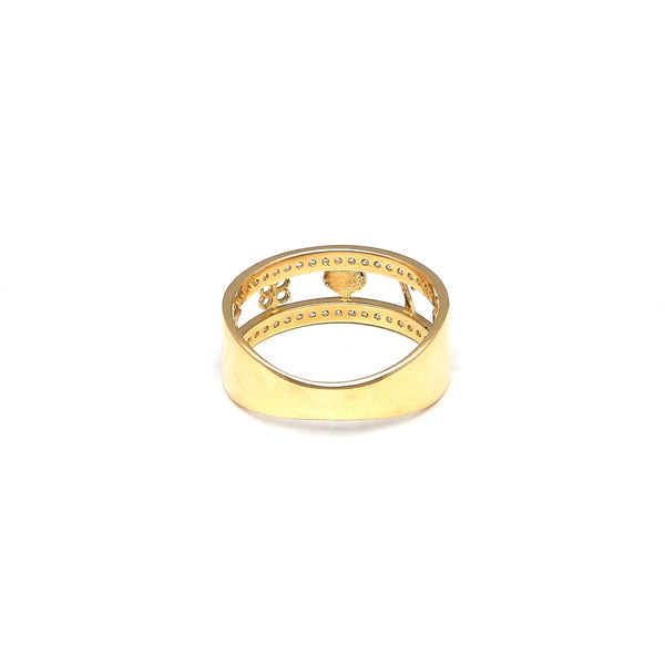 Anillo calado motivos de la suerte y sintéticos en oro amarillo 14 kilates.