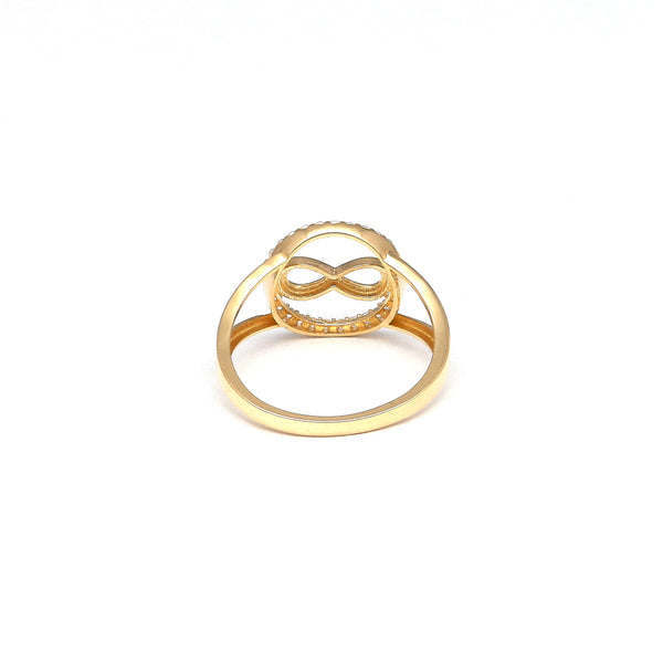 Anillo calado motivo infinito con circonias en oro amarillo 14 kilates.