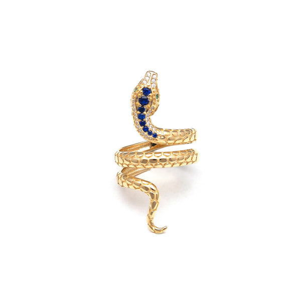 Anillo estilizado motivo serpiente con sintéticos en oro amarillo 14 kilates.