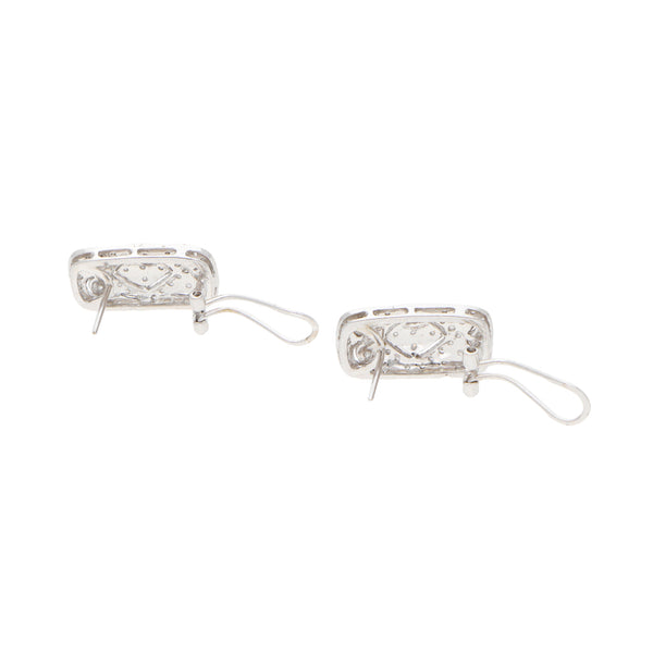 Aretes estilizados con diamantes en oro blanco 14 kilates.