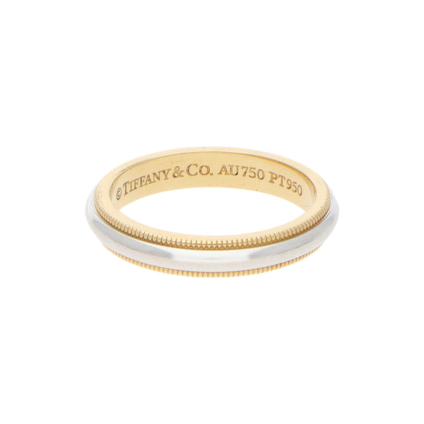 Argolla diseño especial firma Tiffany & Co en platino 950 y oro amarillo 18 kilates.