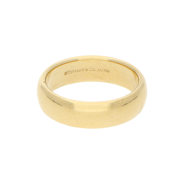Argolla lisa firma Tiffany & Co en oro amarillo 18 kilates.