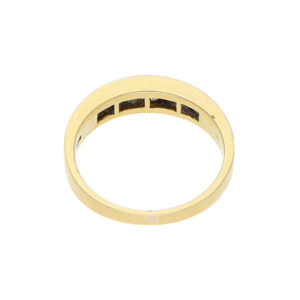 Anillo diseño especial con diamante y zafiros en oro amarillo 18 kilates.