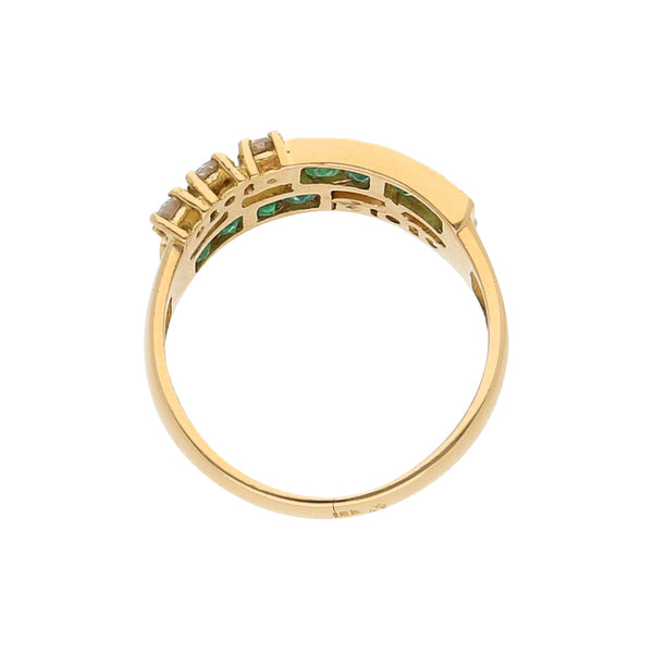 Anillo diseño especial con diamantes y sintéticos en oro amarillo 18 kilates.