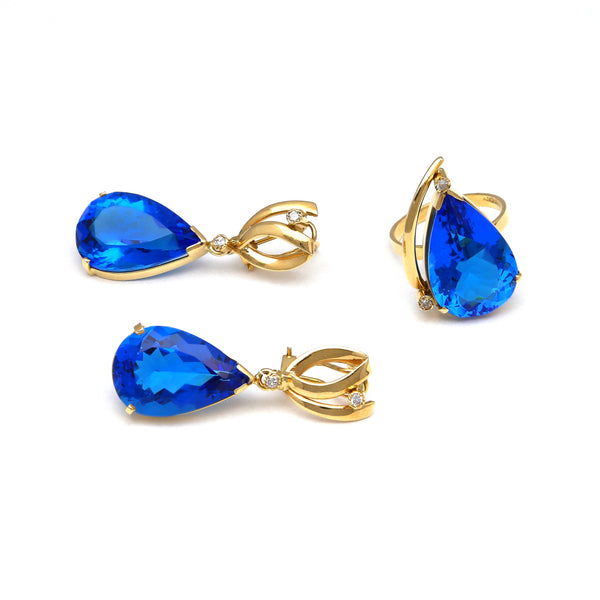 Juego de anillo y aretes diseño especial con diamantes y obsidianas azules en oro amarillo 14 kilates.