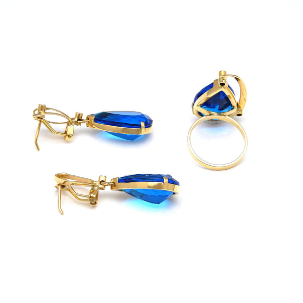 Juego de anillo y aretes diseño especial con diamantes y obsidianas azules en oro amarillo 14 kilates.