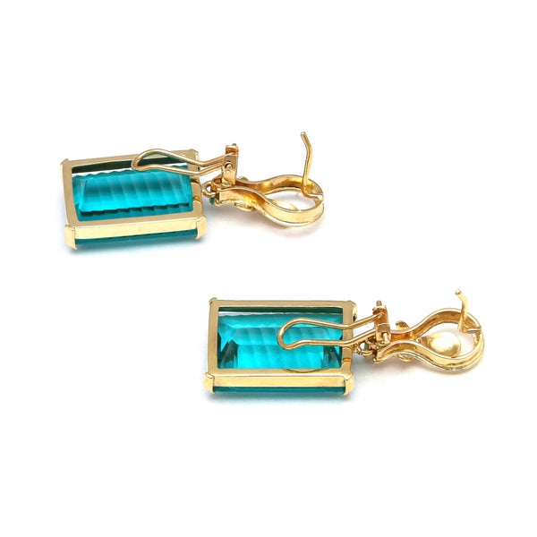 Juego aretes y dije estilizados con diamantes y obsidiana paraiba en oro amarillo 14 kilates.