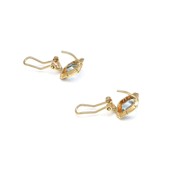 Aretes calados con topacios azules en oro amarillo 14 kilates.