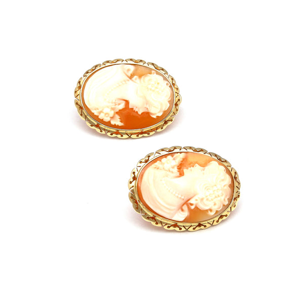 Aretes estilizados con corniolas motivo dama en oro amarillo 14 kilates.