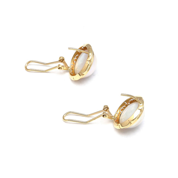 Aretes calados con medias perlas en oro amarillo 14 kilates.