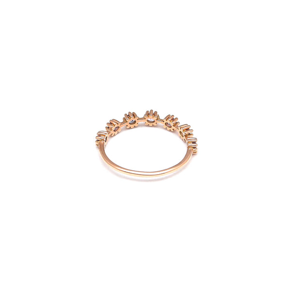 Anillo estilizado con tanzanitas en oro rosa 14 kilates.