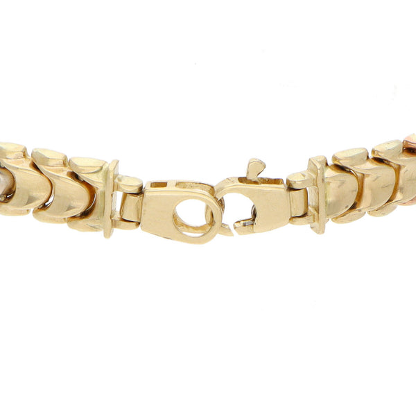 Pulsera eslabón combinado en oro amarillo 14 kilates.