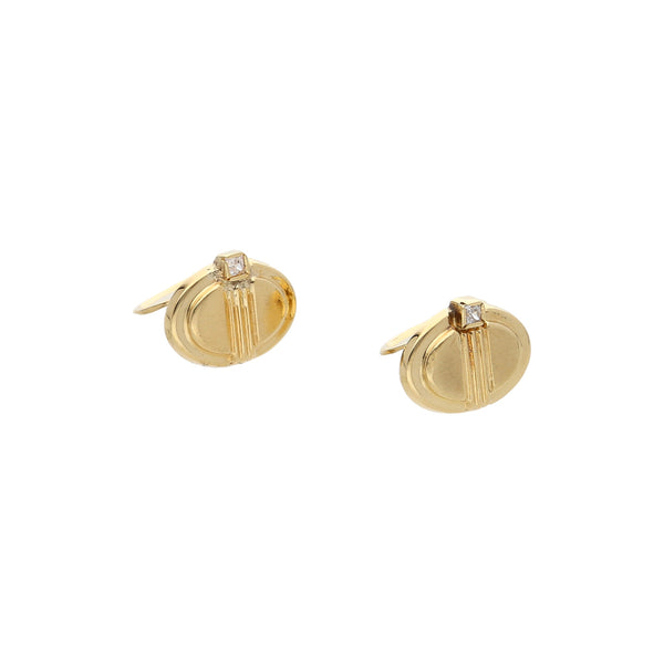 Mancuernillas diseño especial con circonias en oro amarillo 18 kilates.