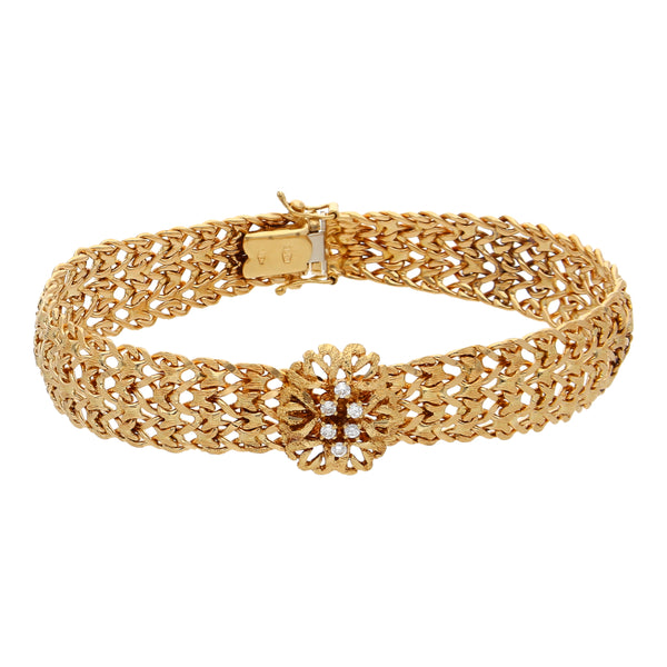 Pulsera eslabón tejido con aplicación y diamantes en oro amarillo 18 kilates.