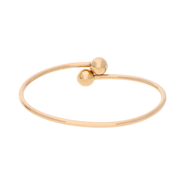 Pulsera ovalada abierta con aplicaciones motivo esfera firma Tiffany & Co en oro rosa 18 kilates.